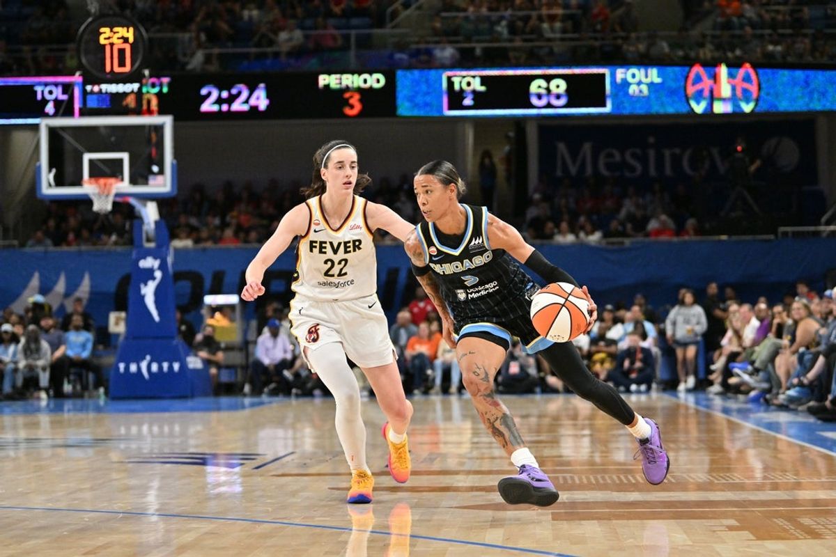 Aug 23, 2026; Chicago, Illinois, USA;  Chicago Sky guard Natasha Cloud (9) drives the ball against Indiana Fever guard Caitlin Clark (22) during the second half at Wintrust Arena.  Mandatory Credit: Patrick Gorski-Imagn Images