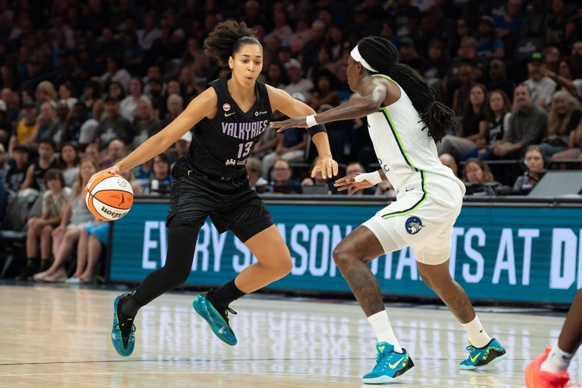 Aug 24, 2026; Minneapolis, Minnesota, USA;  Golden State Valkyries forward Janelle Salaun (13) dribbles the ball as Minnesota Lynx forward Natasha Howard (1) plays defense in the first half at Target Center.  Mandatory Credit: Jesse Johnson-Imagn Images