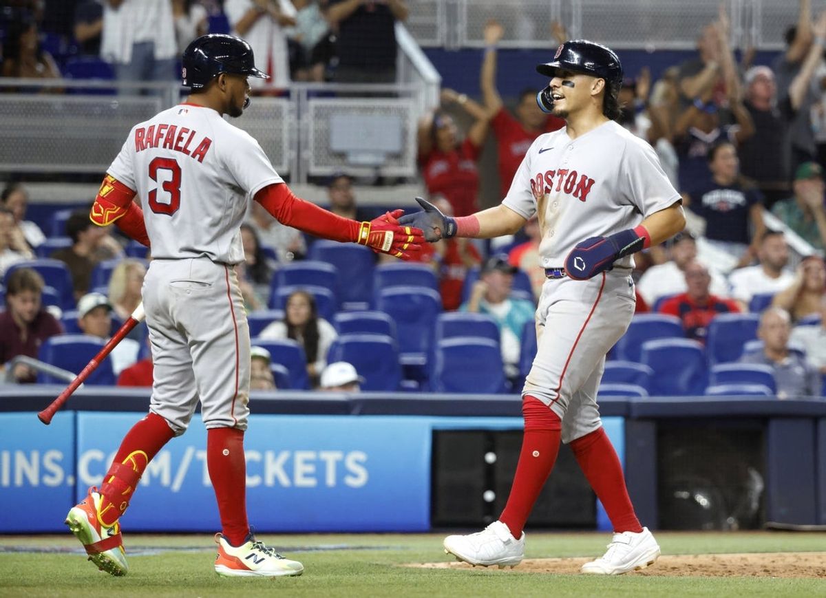 Aug 24, 2026; Miami, Florida, USA;  Boston Red Sox second baseman Anthony Seigler (48) is greeted at home plate by Boston Red Sox center fielder Ceddanne Rafaela (3) after scoring against the Miami Marlins during the ninth inning  at loanDepot Park.  Mandatory Credit: Rhona Wise-Imagn Images