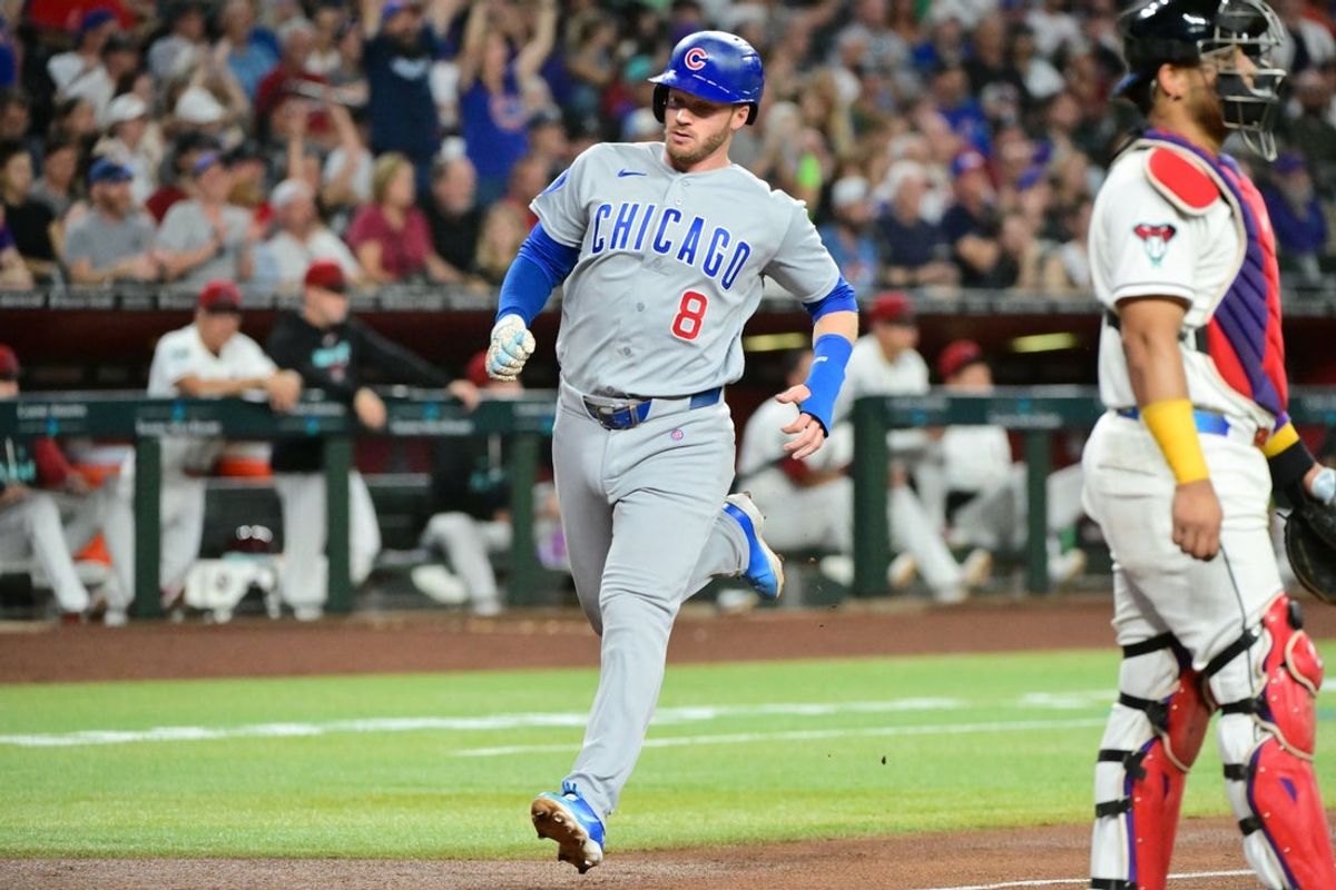 Aug 24, 2026; Phoenix, Arizona, USA;  Chicago Cubs left fielder Ian Happ (8) scores in the second inning against the Arizona Diamondbacks at Chase Field.  Mandatory Credit: Matt Kartozian-Imagn Images