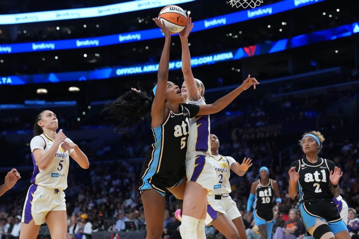 Aug 24, 2026; Los Angeles, California, USA; Atlanta Dream forward Angel Reese (5) shoots the ball against LA Sparks forward Cameron Brink (22) in the first half at Crypto.com Arena. Mandatory Credit: Kirby Lee-Imagn Images