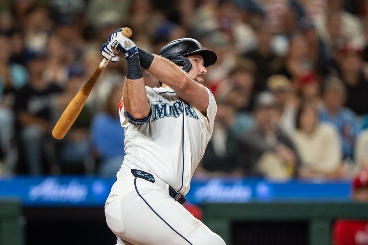 Aug 24, 2026; Seattle, Washington, USA;  Seattle Mariners catcher Cal Raleigh (29) hits a solo home run during the fifth inning against the Philadelphia Phillies at T-Mobile Park. Mandatory Credit: Stephen Brashear-Imagn Images