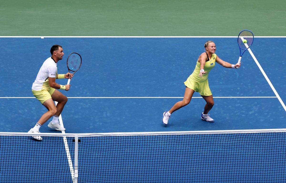 August 25, 2026; New York, United States;  Russia's Diana Shnaider in action with Norway's Casper Ruud during the mixed doubles round of 16 match against Jessica Pegula of the U.S. and Taylor Fritz of the U.S.  Mandatory Credit: Mike Frey-Imagn Images