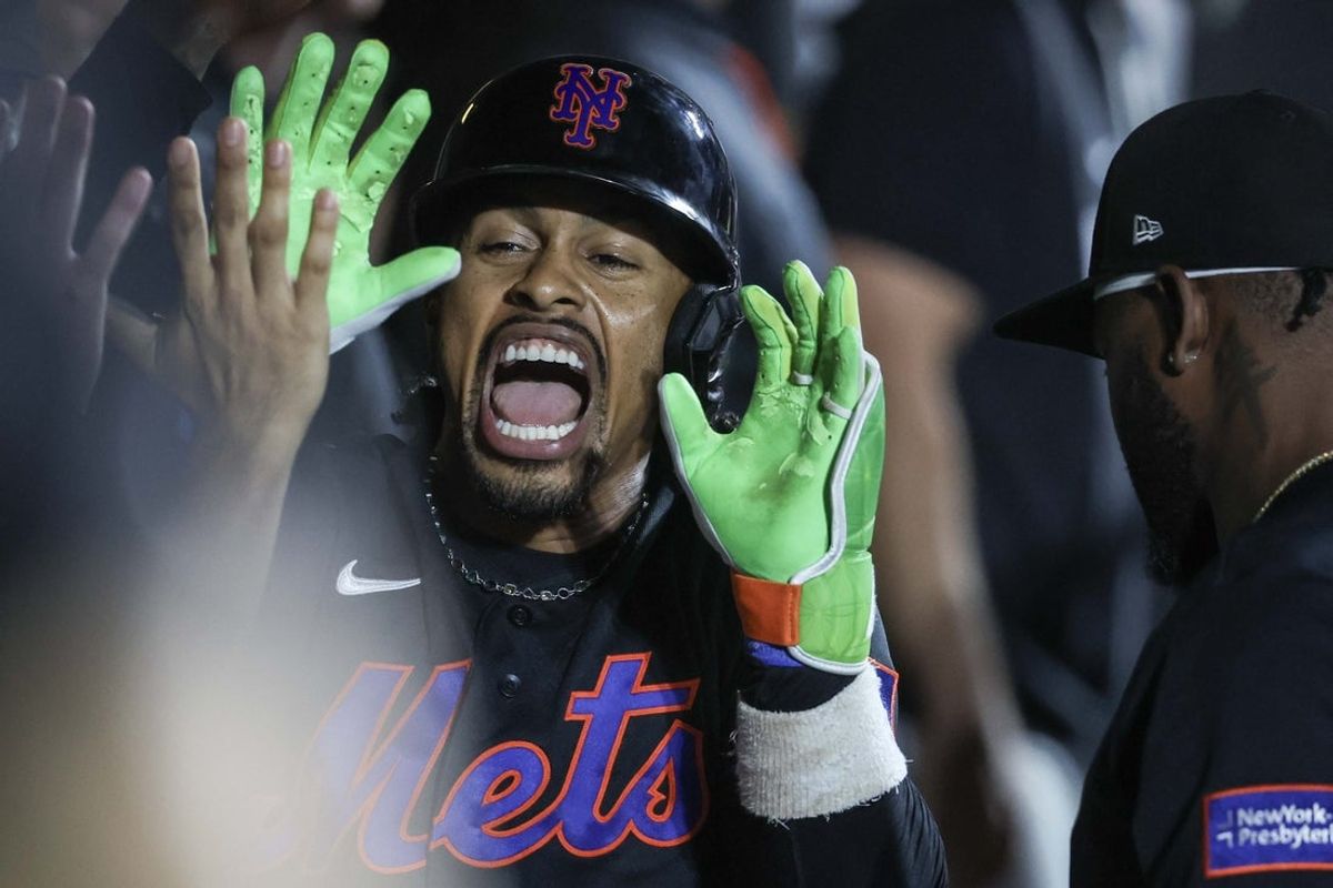 Aug 25, 2026; New York City, New York, USA;  New York Mets shortstop Francisco Lindor (12) celebrates in the dugout with his teammates after after hitting a solo home run in the fifth inning against the Milwaukee Brewers at Citi Field.  Mandatory Credit: Wendell Cruz-Imagn Images