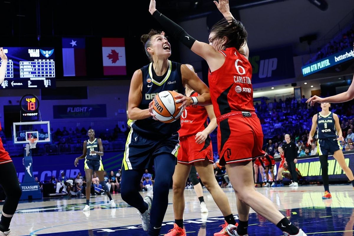 Aug 25, 2026; Arlington, Texas, USA;  Dallas Wings forward Jessica Shepard (32) looks to shoot against Portland Fire forward Bridget Carleton (6) during the first half at College Park Center.  Mandatory Credit: Chris Jones-Imagn Images