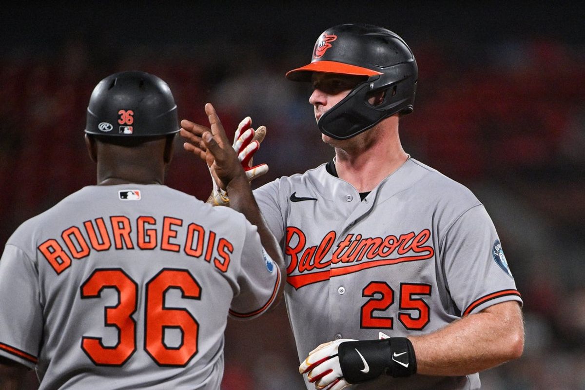 Aug 25, 2026; St. Louis, Missouri, USA; Baltimore Orioles first baseman Pete Alonso (25) celebrates with first base coach Jason Bourgeois (36) after hitting a single against the St. Louis Cardinals during the fifth inning at Busch Stadium. Mandatory Credit: Jeff Curry-Imagn Images