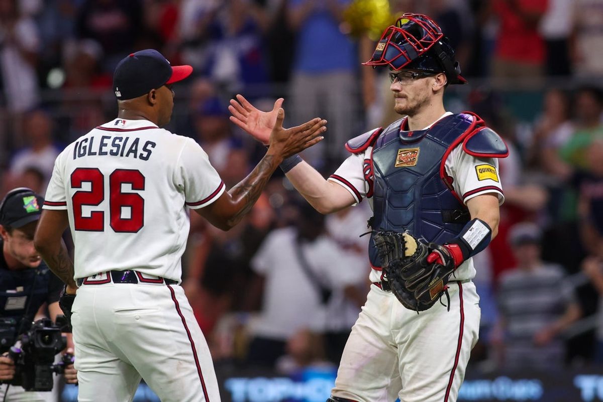 Aug 25, 2026; Atlanta, Georgia, USA; Atlanta Braves relief pitcher Raisel Iglesias (26) celebrates with catcher Sean Murphy (12) after a victory over the Los Angeles Dodgers at Truist Park. Mandatory Credit: Brett Davis-Imagn Images