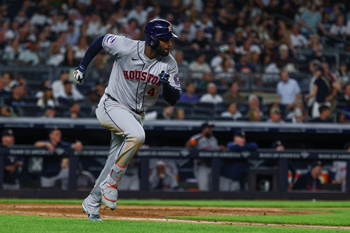 Aug 25, 2026; Bronx, New York, USA; Houston Astros designated hitter Yordan Alvarez (44) hits an RBI triple during the eighth inning against the New York Yankees  at Yankee Stadium. Mandatory Credit: Vincent Carchietta-Imagn Images