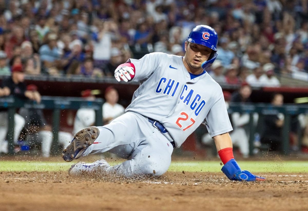 Aug 25, 2026; Phoenix, Arizona, USA; Chicago Cubs base runner Seiya Suzuki scores in the sixth inning against the Arizona Diamondbacks at Chase Field. Mandatory Credit: Mark J. Rebilas-Imagn Images
