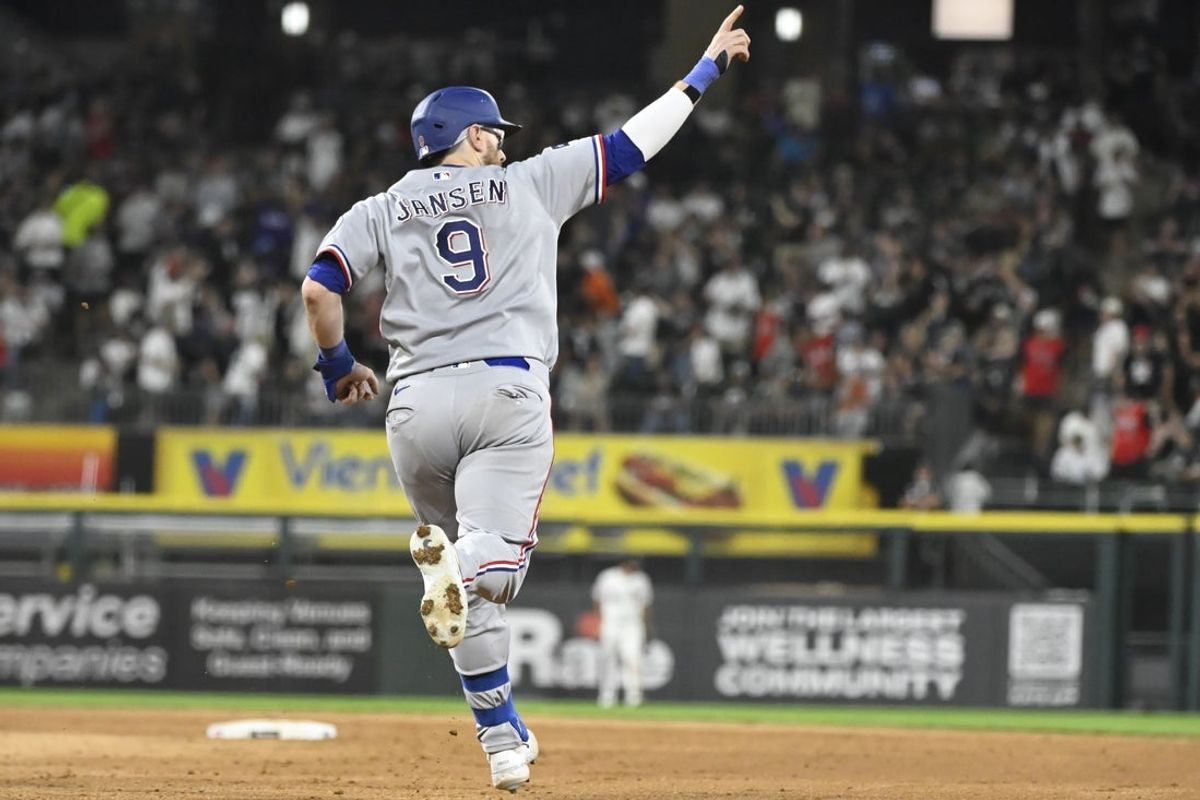 Aug 25, 2026; Chicago, Illinois, USA;  Texas Rangers catcher Danny Jansen (9) points after he hits a two run home run during the fifth inning against the Chicago White Sox at Rate Field.  Mandatory Credit: Matt Marton-Imagn Images