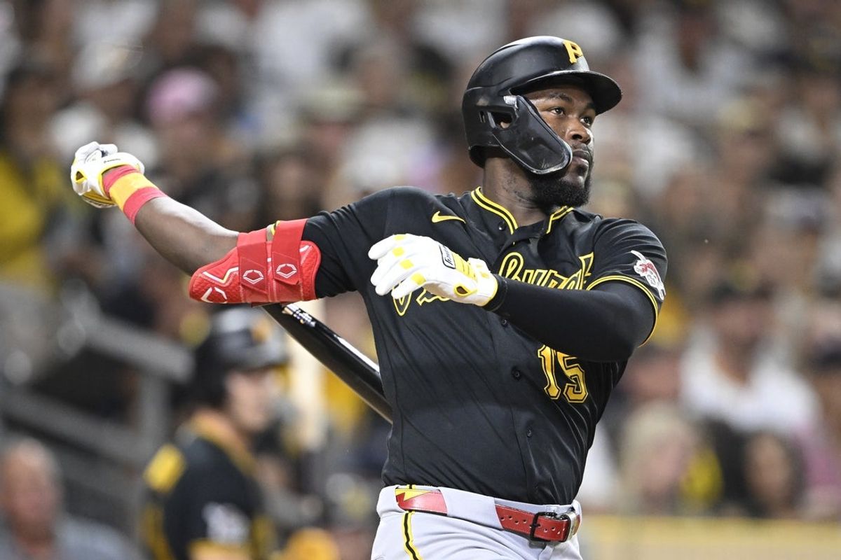 Aug 25, 2026; San Diego, California, USA;  Pittsburgh Pirates center fielder Oneil Cruz (15) hits a solo home run during the ninth inning against the San Diego Padres at Petco Park.  Mandatory Credit: Denis Poroy-Imagn Images