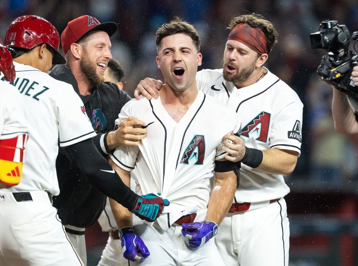 Aug 25, 2026; Phoenix, Arizona, USA; Arizona Diamondbacks pinch hitter Ryan Waldschmidt (right) celebrates with teammates Merrill Kelly and Tim Tawa after hitting a two run walk off home run in the ninth inning against the Chicago Cubs at Chase Field. Mandatory Credit: Mark J. Rebilas-Imagn Images