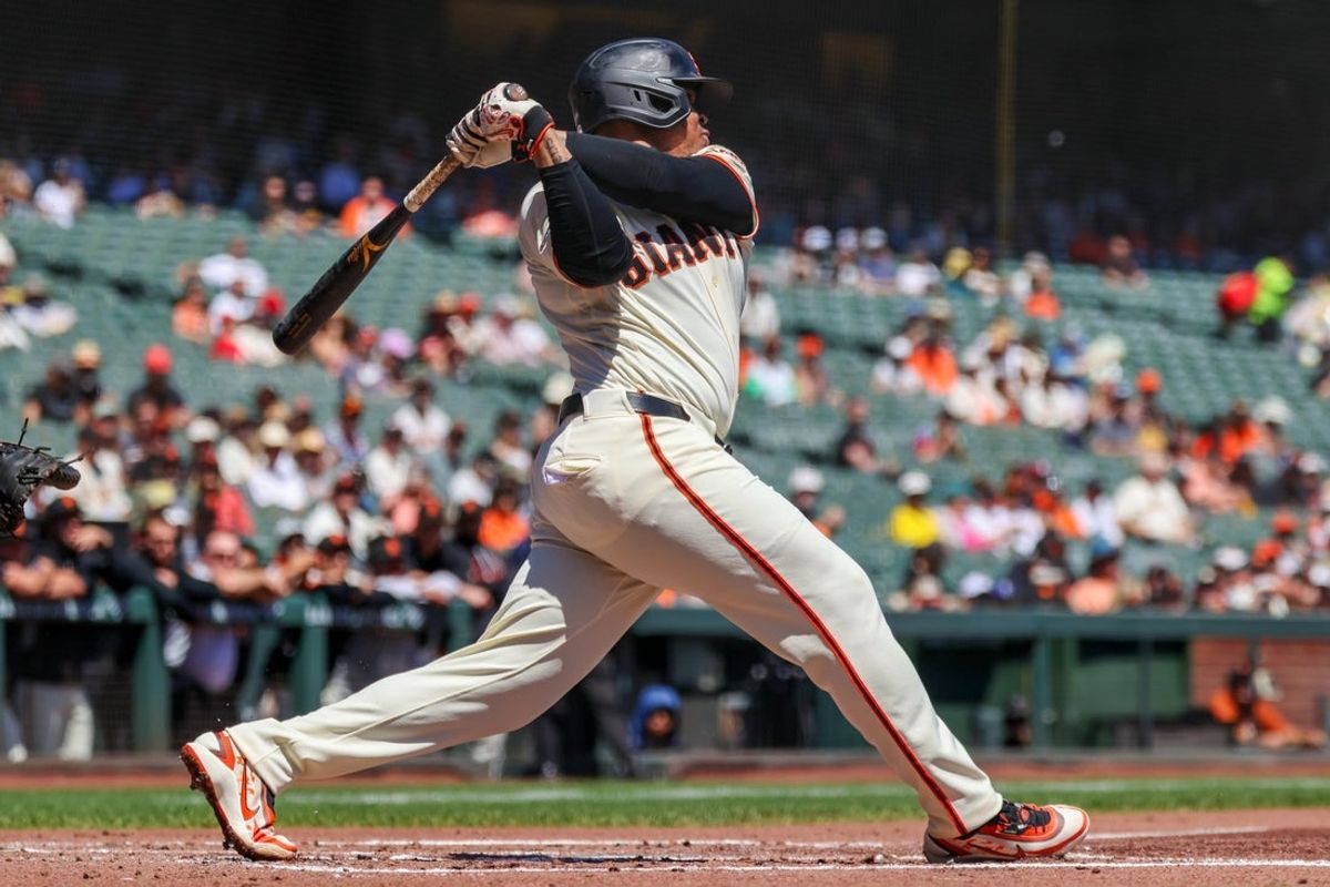 Aug 26, 2026; San Francisco, California, USA;  San Francisco Giants first baseman Rafael Devers (16) hits a single during the first inning against the Cincinnati Reds at Oracle Park.  Mandatory Credit: Sergio Estrada-Imagn Images