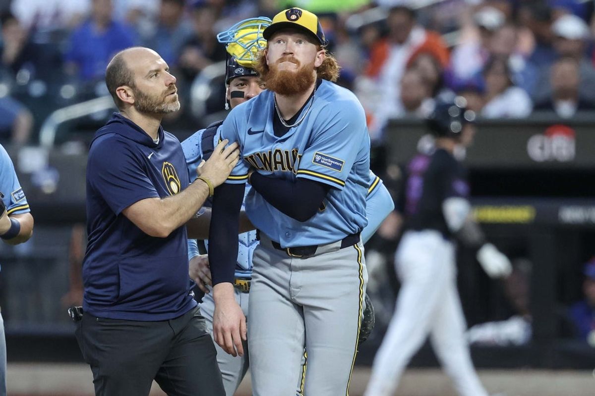 Aug 26, 2026; New York City, New York, USA;  Milwaukee Brewers starting pitcher Dustin May (21) is looked on after getting hit by a line drive in the first inning against the New York Mets at Citi Field.  Mandatory Credit: Wendell Cruz-Imagn Images