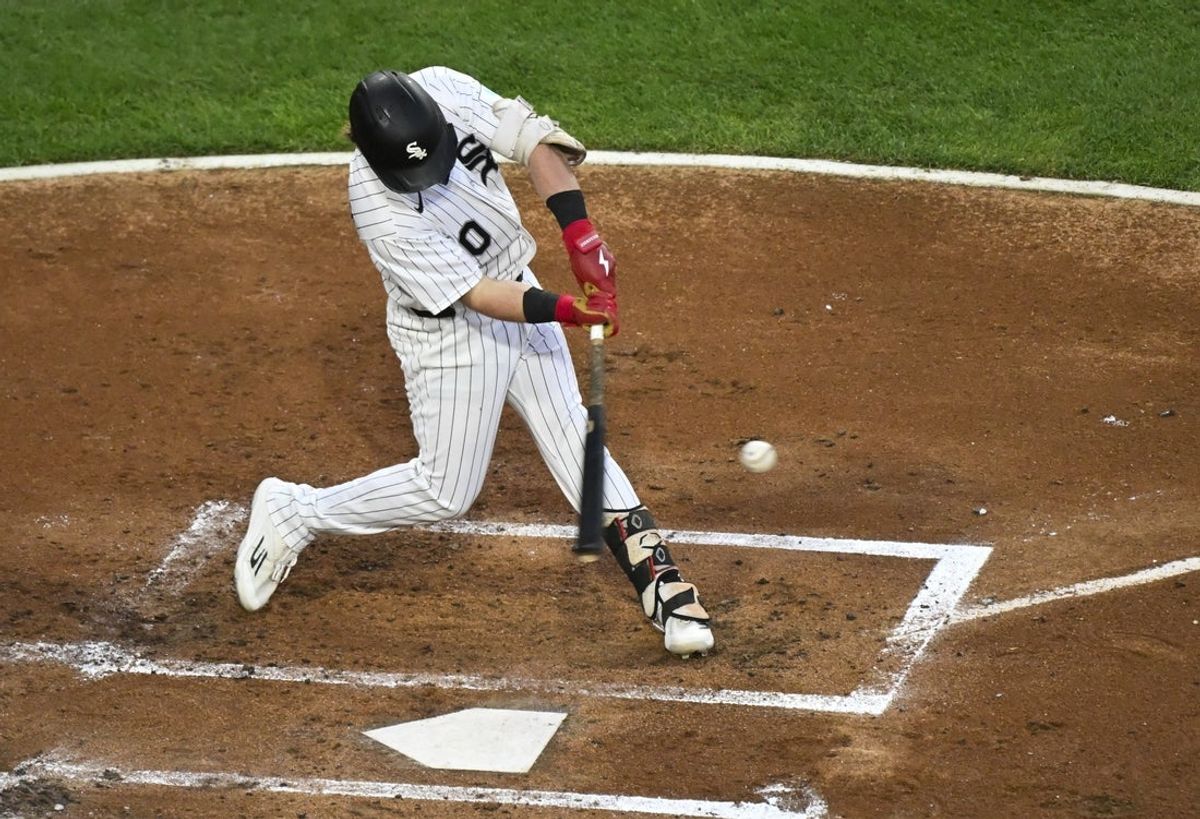 Aug 26, 2026; Chicago, Illinois, USA;  Chicago White Sox second baseman Chase Meidroth (10) hits a double during the second inning against the Texas Rangers at Rate Field.  Mandatory Credit: Matt Marton-Imagn Images
