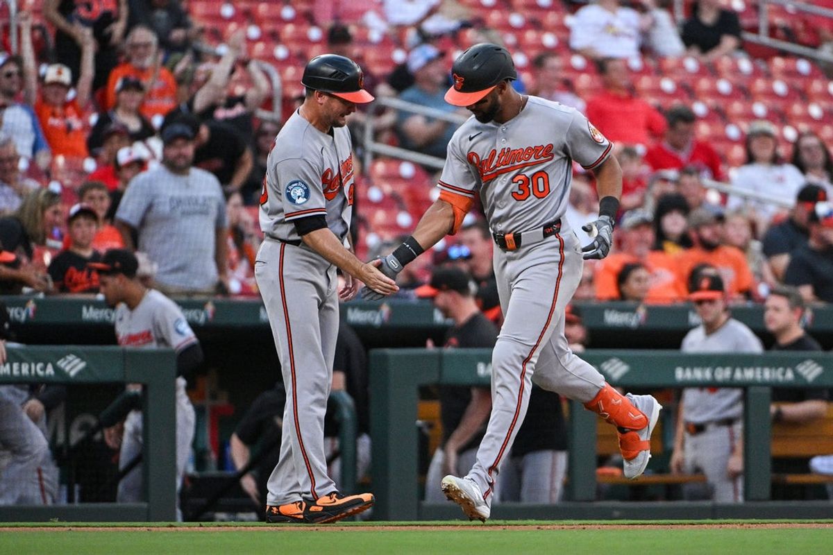 Aug 26, 2026; St. Louis, Missouri, USA; Baltimore Orioles right fielder Leody Taveras (30) is congratulated by third base coach Buck Britton (46) after hitting a three run home run against the St. Louis Cardinals during the first inning at Busch Stadium. Mandatory Credit: Jeff Curry-Imagn Images