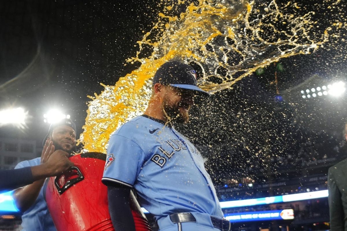 Aug 26, 2026; Toronto, Ontario, CAN;  Toronto Blue Jays right fielder Nathan Lukes (38)  gets doused with a sport drink after a win over the Kansas City Royals at Rogers Centre.  Mandatory Credit: John E. Sokolowski-Imagn Images