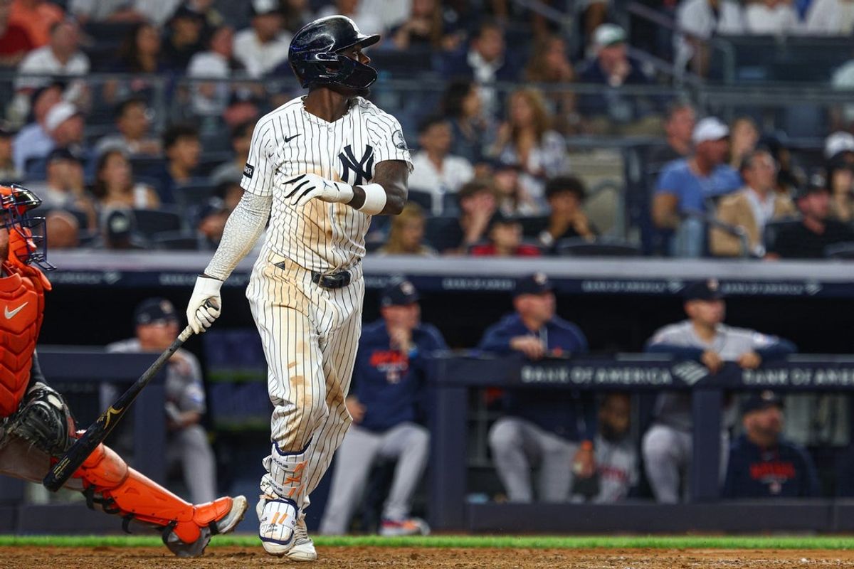 Aug 26, 2026; Bronx, New York, USA; New York Yankees second baseman Jazz Chisholm Jr. (13) hits an RBI double during the seventh inning against the Houston Astros at Yankee Stadium. Mandatory Credit: Vincent Carchietta-Imagn Images