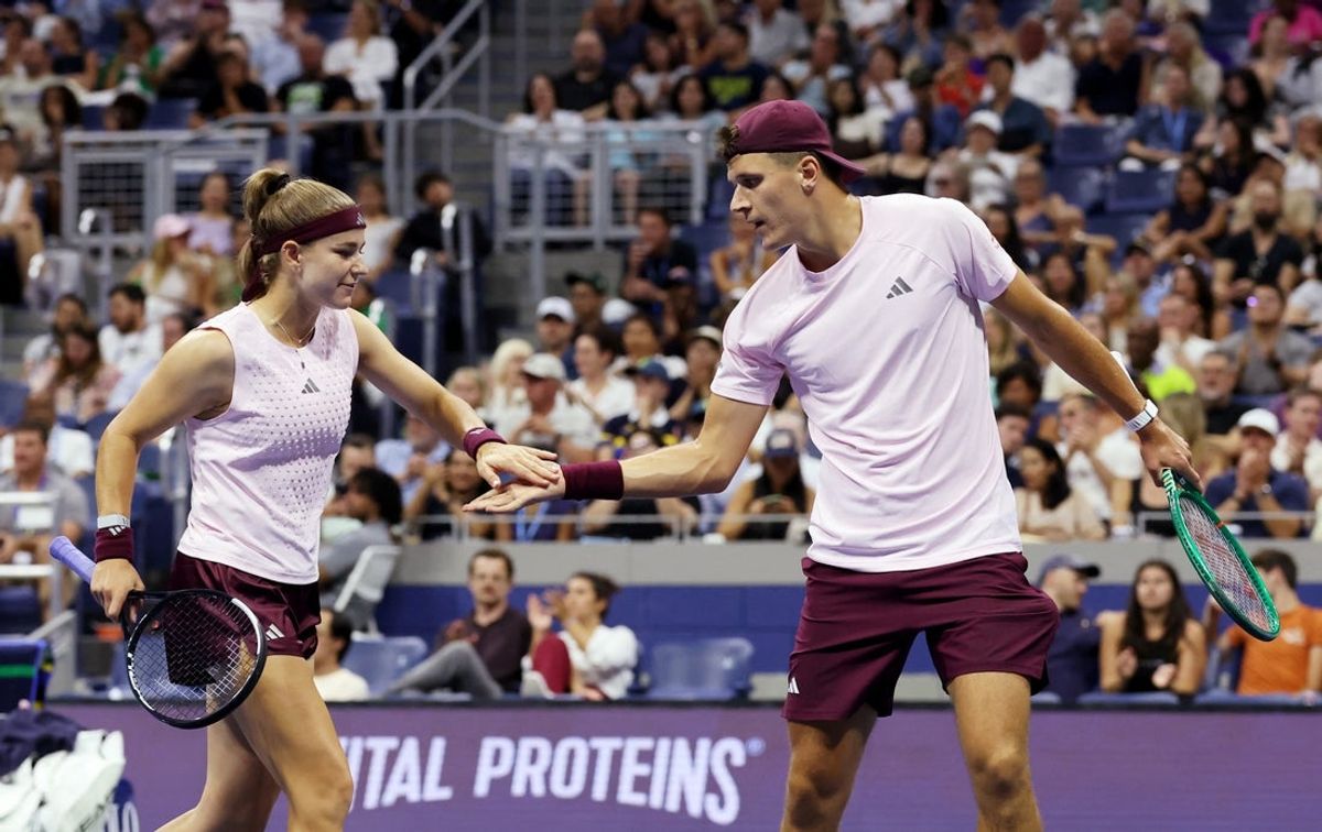 August 26, 2026; New York, United States; Czech Republic's Karolina Muchova and Czech Republic's Jakub Mensik during their mixed doubles final match against Switzerland's Belinda Bencic and Italy's Flavio Cobolli.  Mandatory Credit: Mike Frey-Imagn Images