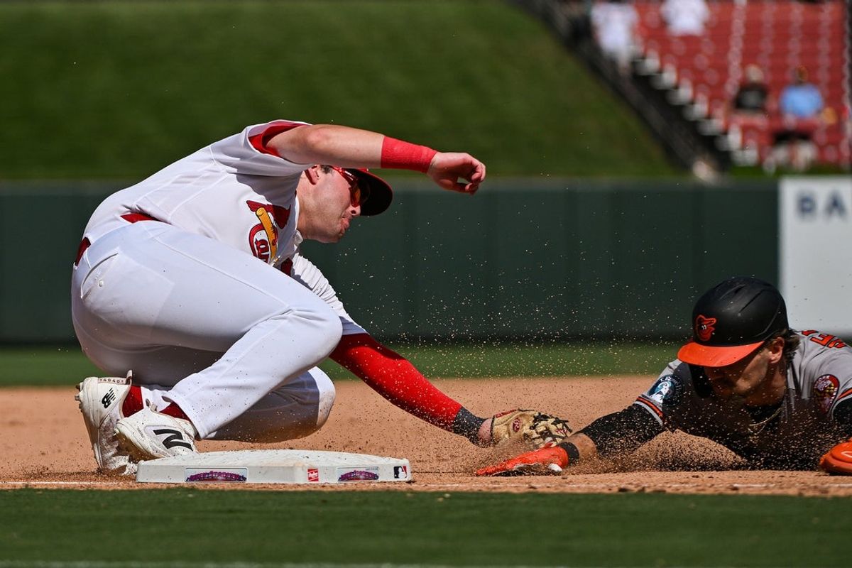 Aug 27, 2026; St. Louis, Missouri, USA; St. Louis Cardinals third baseman Blaze Jordan (33) injuries his ankle as he tags out Baltimore Orioles shortstop Gunnar Henderson (2) during the eighth inning at Busch Stadium. Mandatory Credit: Jeff Curry-Imagn Images