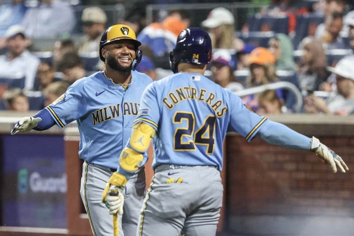Aug 27, 2026; New York City, New York, USA;  Milwaukee Brewers left fielder Jackson Chourio (11) is greeted by designated hitter William Contreras (24) after hitting a two run home run in the second inning against the New York Mets at Citi Field.  Mandatory Credit: Wendell Cruz-Imagn Images