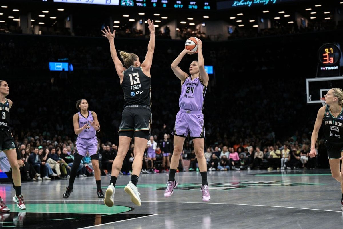 Aug 27, 2026; Brooklyn, New York, USA;  Golden State Valkyries forward Cecilia Zandalasini (24) shoots the ball while defended by New York Liberty forward Leonie Fiebich (13) during the first half at Barclays Center.  Mandatory Credit: John Jones-Imagn Images