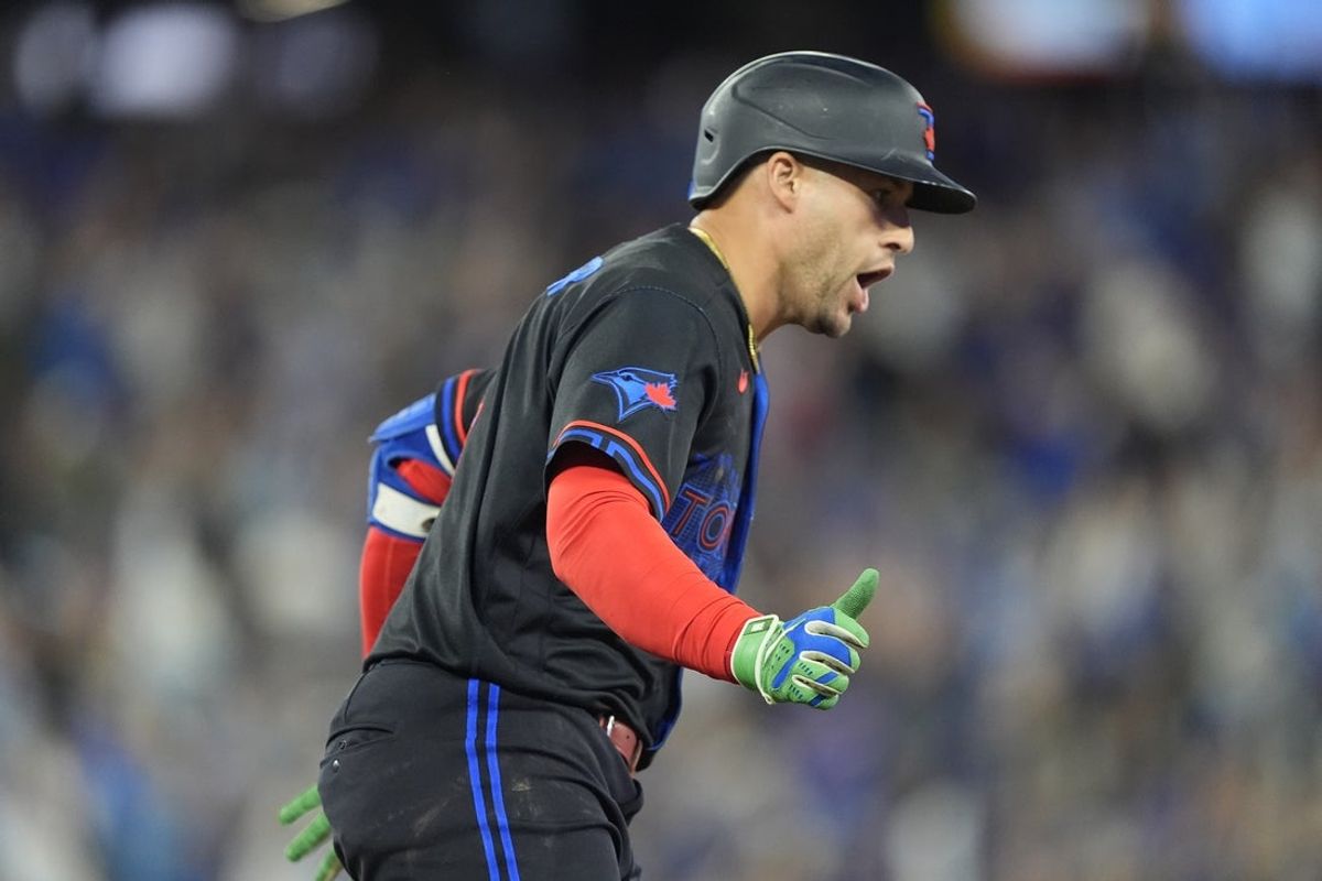 Aug 28, 2026; Toronto, Ontario, CAN;  Toronto Blue Jays designated hitter George Springer (4) reacts as he runs the bases on his solo home run against the Seattle Mariners during the fifth inning at Rogers Centre.  Mandatory Credit: John E. Sokolowski-Imagn Images