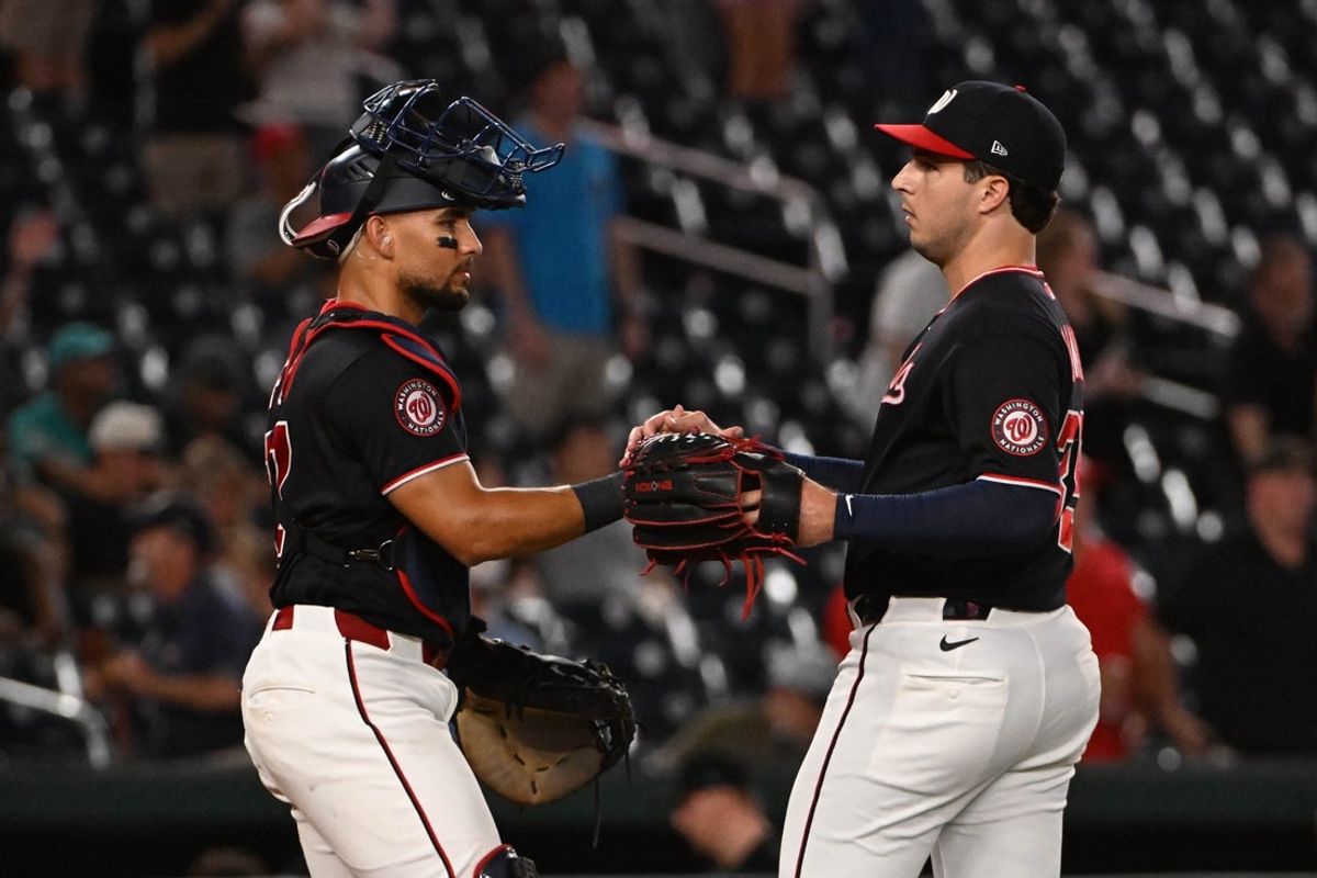 Aug 28, 2026; Washington, District of Columbia, USA; Washington Nationals pitcher Max Kranick (35) is congratulated by catcher Harry Ford (17) after the final out against the Miami Marlins at Nationals Park. Mandatory Credit: Brad Mills-Imagn Images