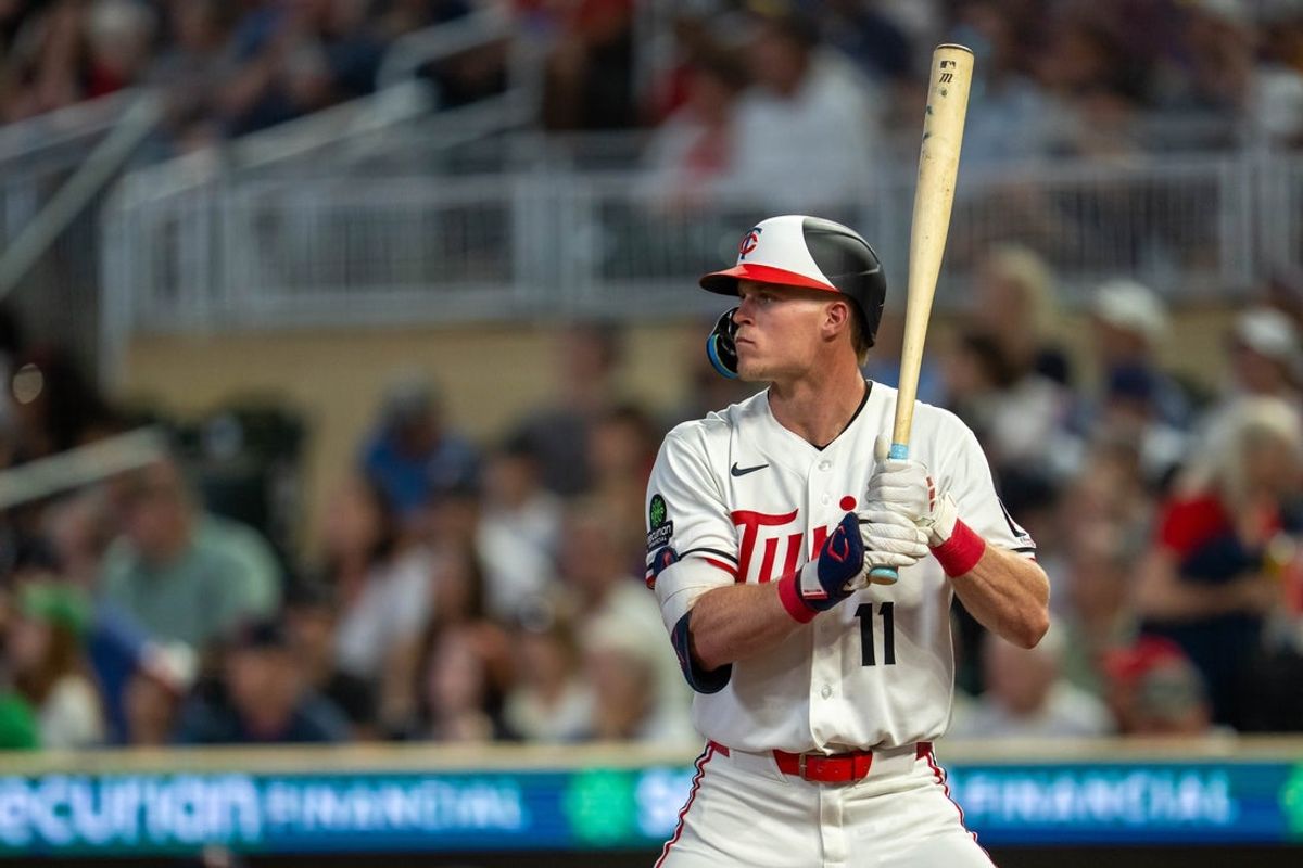 Aug 28, 2026; Minneapolis, Minnesota, USA;  Minnesota Twins center fielder Walker Jenkins (11) stands at home plate before a pitch against the Chicago White Sox in the fourth inning at Target Field.  Mandatory Credit: Jesse Johnson-Imagn Images