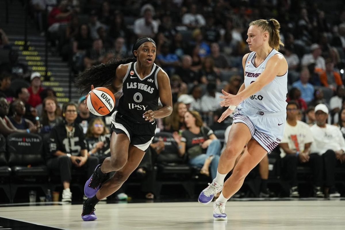 Aug 28, 2026; Las Vegas, Nevada, USA;  Las Vegas Aces guard Jackie Young (0) dribbles the ball against Toronto Tempo forward Laura Juskaite (2) during the second quarter of a WNBA basketball game at Michelob Ultra Arena.  Mandatory Credit: Lucas Peltier-Imagn Images