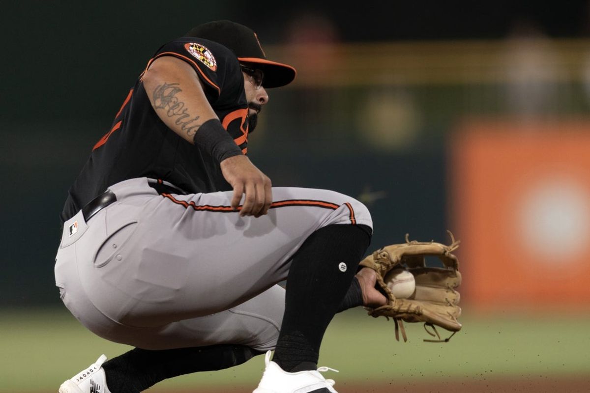Aug 28, 2026; West Sacramento, California, USA;  Baltimore Orioles third baseman Christian Encarnacion-Strand (32) snags a line drive by Athletics third baseman Zack Gelof (20) during the fourth inning at Sutter Health Park.  Mandatory Credit: D. Ross Cameron-Imagn Images