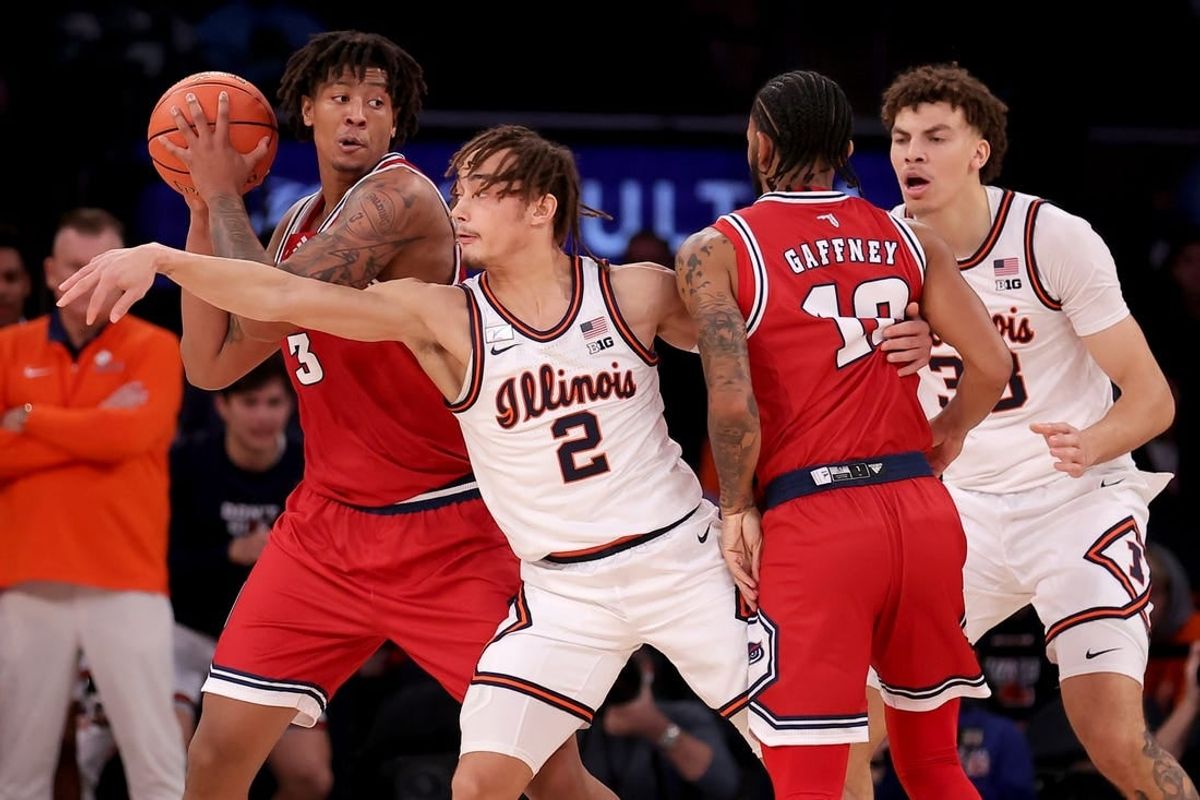 Dec 5, 2023; New York, New York, USA; Florida Atlantic Owls forward Giancarlo Rosado (3) controls the ball against Illinois Fighting Illini guard Dra Gibbs-Lawhorn (2) and forward Coleman Hawkins (33) during the first half at Madison Square Garden.