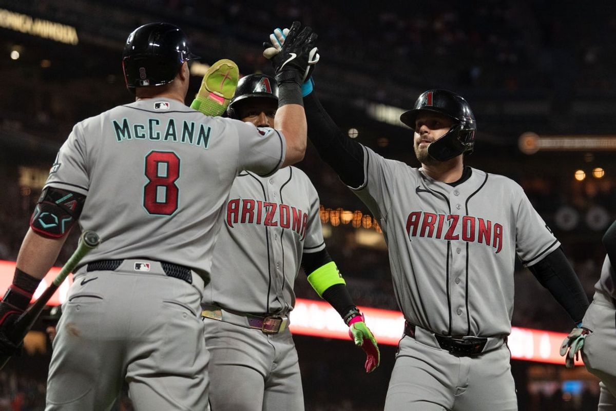 Aug 28, 2026; San Francisco, California, USA;  Arizona Diamondbacks first baseman Tim Tawa (13) , right , celebrates with his teammates after hitting a three-run home run during the third inning against the San Francisco Giants at Oracle Park.  Mandatory Credit: Stan Szeto-Imagn Images
