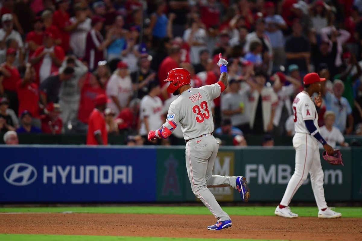 Aug 28, 2026; Anaheim, California, USA; Philadelphia Phillies left fielder Edmundo Sosa (33) runs the bases after hitting a grand slam home run against the Los Angeles Angels during the ninth inning at Angel Stadium. Mandatory Credit: Gary A. Vasquez-Imagn Images