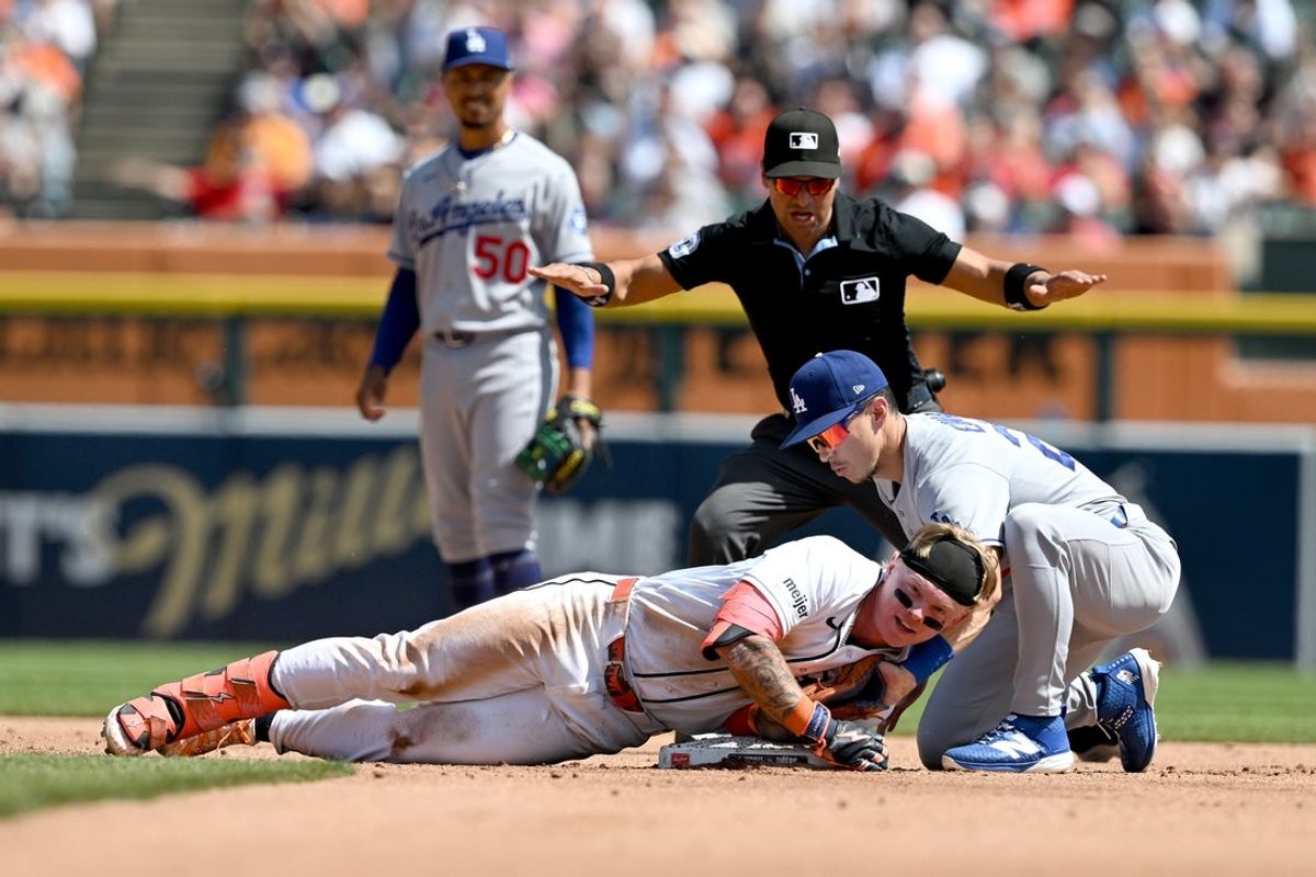 Aug 29, 2026; Detroit, Michigan, USA;  Detroit Tigers center fielder Max Clark (15) slides safely into second base for a leadoff double ahead of the tag from Los Angeles Dodgers second baseman Tommy Edman (25) in the fifth inning at Comerica Park.  Mandatory Credit: Lon Horwedel-Imagn Images