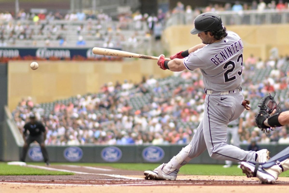 Aug 29, 2026; Minneapolis, Minnesota, USA;  Chicago White Sox designated hitter Andrew Benintendi (23) hits an RBI single against the Minnesota Twins during the first inning at Target Field.  Mandatory Credit: Nick Wosika-Imagn Images