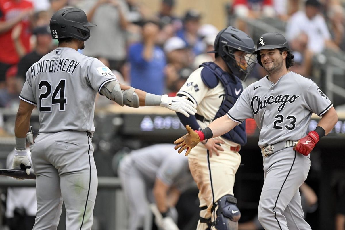Aug 29, 2026; Minneapolis, Minnesota, USA;  Chicago White Sox designated hitter Andrew Benintendi (23) celebrates his solo home run against the Minnesota Twins with outfielder Braden Montgomery (24) during the sixth inning at Target Field.  Mandatory Credit: Nick Wosika-Imagn Images