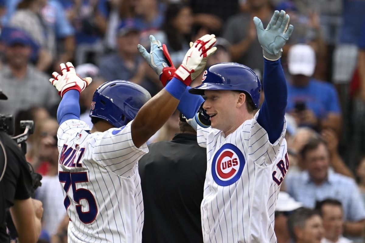 Aug 29, 2026; Chicago, Illinois, USA;  Chicago Cubs center fielder Pete Crow-Armstrong (4), right, celebrates with second baseman Pedro Ramirez (75) after they score on his three-run home run against the Cincinnati Reds during the seventh inning at Wrigley Field.  Mandatory Credit: Matt Marton-Imagn Images