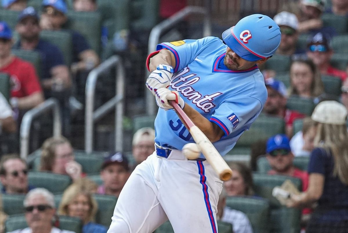 Aug 29, 2026; Cumberland, Georgia, USA; Atlanta Braves catcher Drake Baldwin (30) hits a single against the Colorado Rockies during the third inning at Truist Park. Mandatory Credit: Dale Zanine-Imagn Images