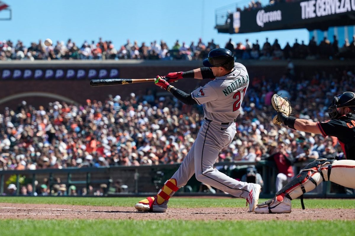 Aug 29, 2026; San Francisco, California, USA; Arizona Diamondbacks outfielder Lars Nootbaar (21) hits a grand slam home run against San Francisco Giants pitcher Ryan Walker (not pictured) during the seventh inning at Oracle Park. Mandatory Credit: Robert Edwards-Imagn Images