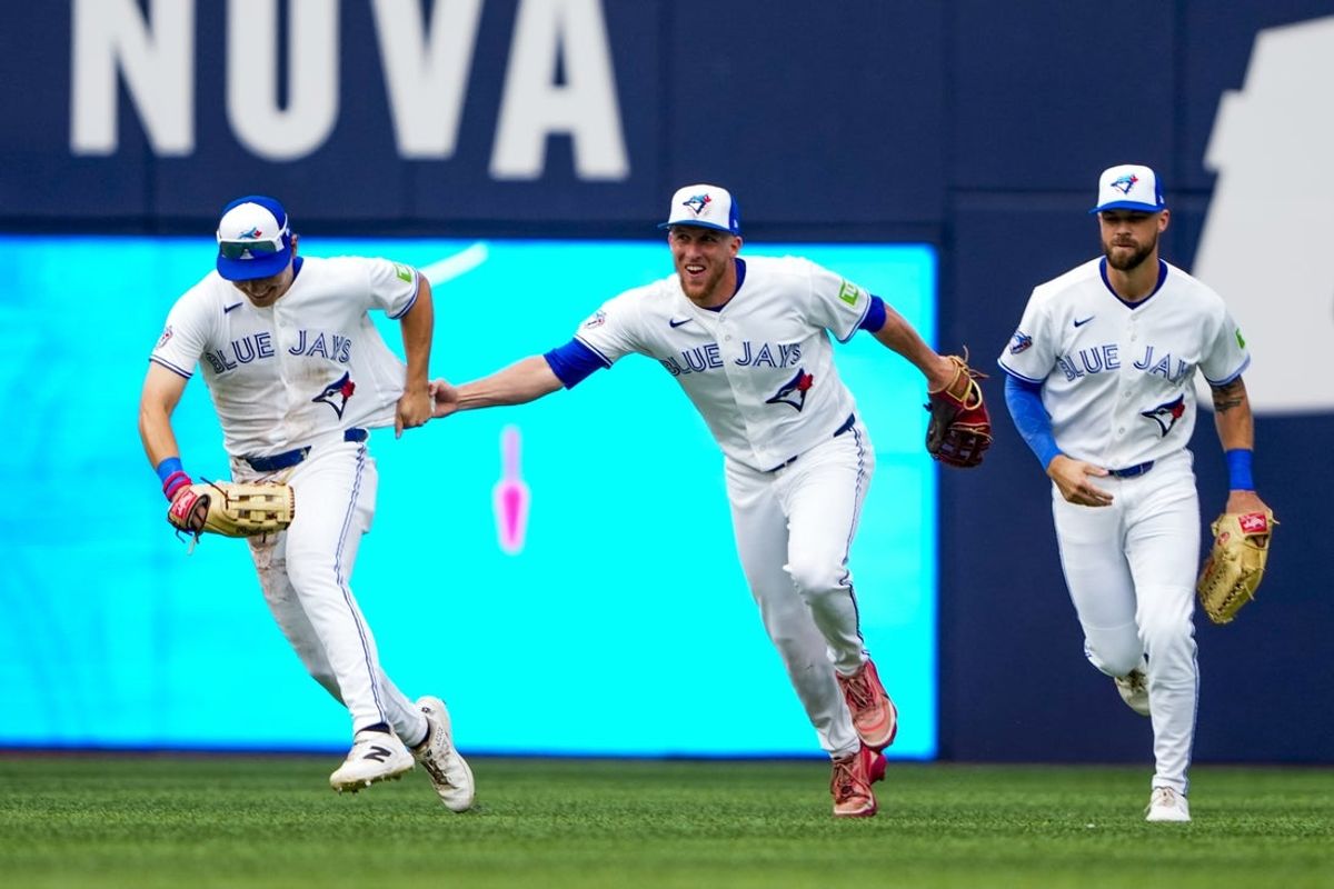 Aug 29, 2026; Toronto, Ontario, CAN;  Toronto Blue Jays center fielder Myles Straw (3) celebrates with center fielder Brett Bateman (21) and right fielder Nathan Lukes (38) after defeating the Seattle Mariners at Rogers Centre.  Mandatory Credit: Kevin Sousa-Imagn Images