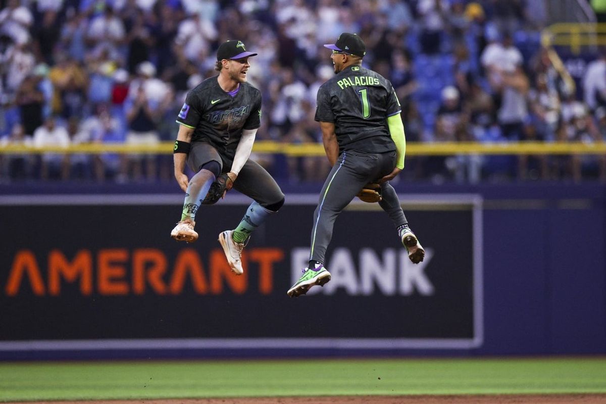 Aug 29, 2026; St. Petersburg, Florida, USA; Tampa Bay Rays shortstop Taylor Walls (6) and second baseman Richie Palacios (1) react after beating the San Diego Padres at Tropicana Field. Mandatory Credit: Nathan Ray Seebeck-Imagn Images