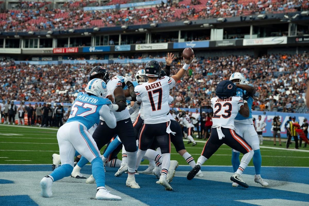 Chicago quarterback Tyson Bagent (17) throws under pressure from Tennessee in his own end zone on Chicago’s first possession of their preseason game at Nissan Stadium Saturday, Aug. 29, 2026. It ended up being a 98-yard touchdown pass.