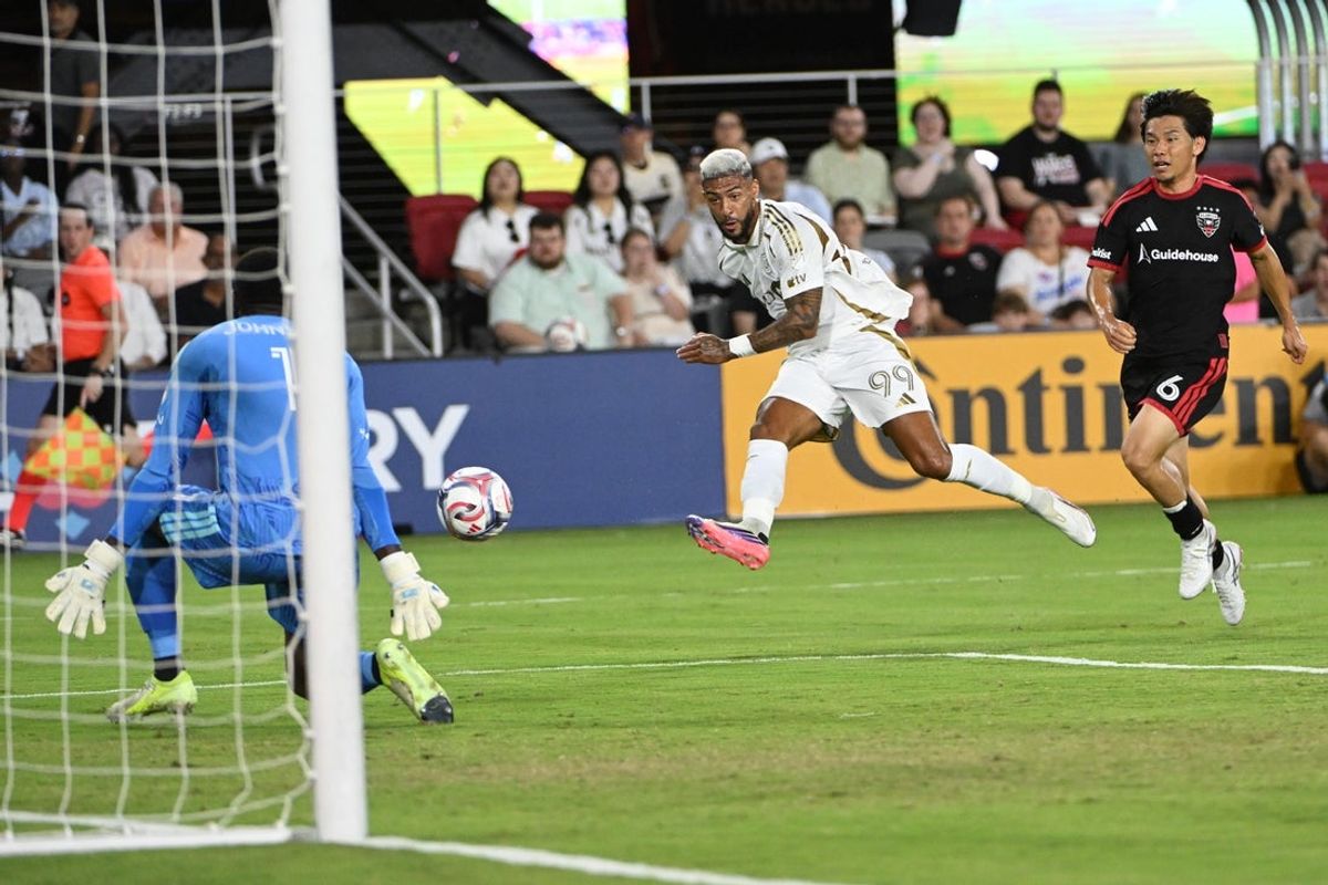 Aug 29, 2026; Washington, District of Columbia, USA; D.C. United goalkeeper Sean Johnson (1) saves the shot by Los Angeles FC forward Denis Bouanga (99) during the first half at Audi Field. Mandatory Credit: Brad Mills-Imagn Images
