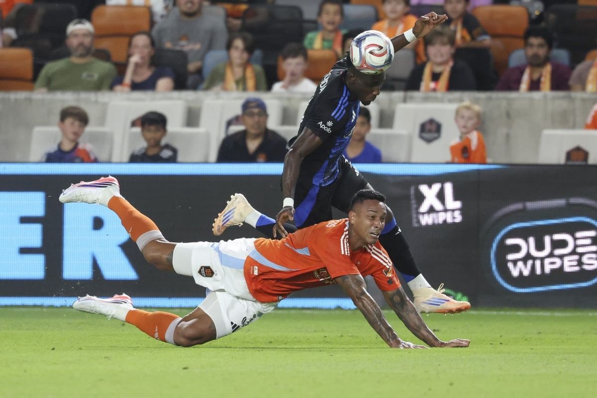 Aug 29, 2026; Houston, Texas, USA; Houston Dynamo FC defender Antonio Carlos (3) and San Jose Earthquakes forward Ousseni Bouda (7) battle for the ball during the first half at Shell Energy Stadium. Mandatory Credit: Troy Taormina-Imagn Images