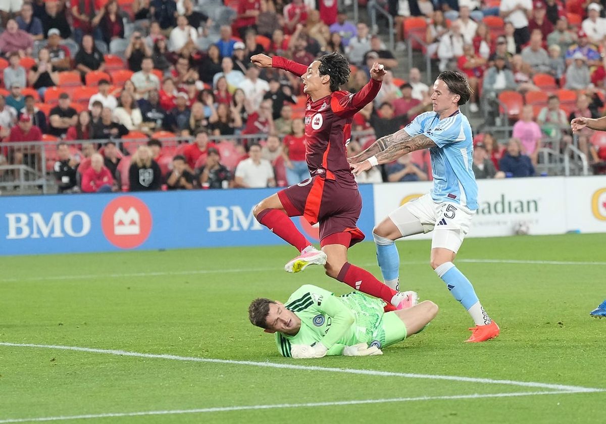 Aug 29, 2026; Toronto, Ontario, CAN;  Toronto FC forward Daniel Salloi (20) scores a goal on New York City goalkeeper Matt Freese (49) during the second half at BMO Field.  Mandatory Credit: Nick Turchiaro-Imagn Images