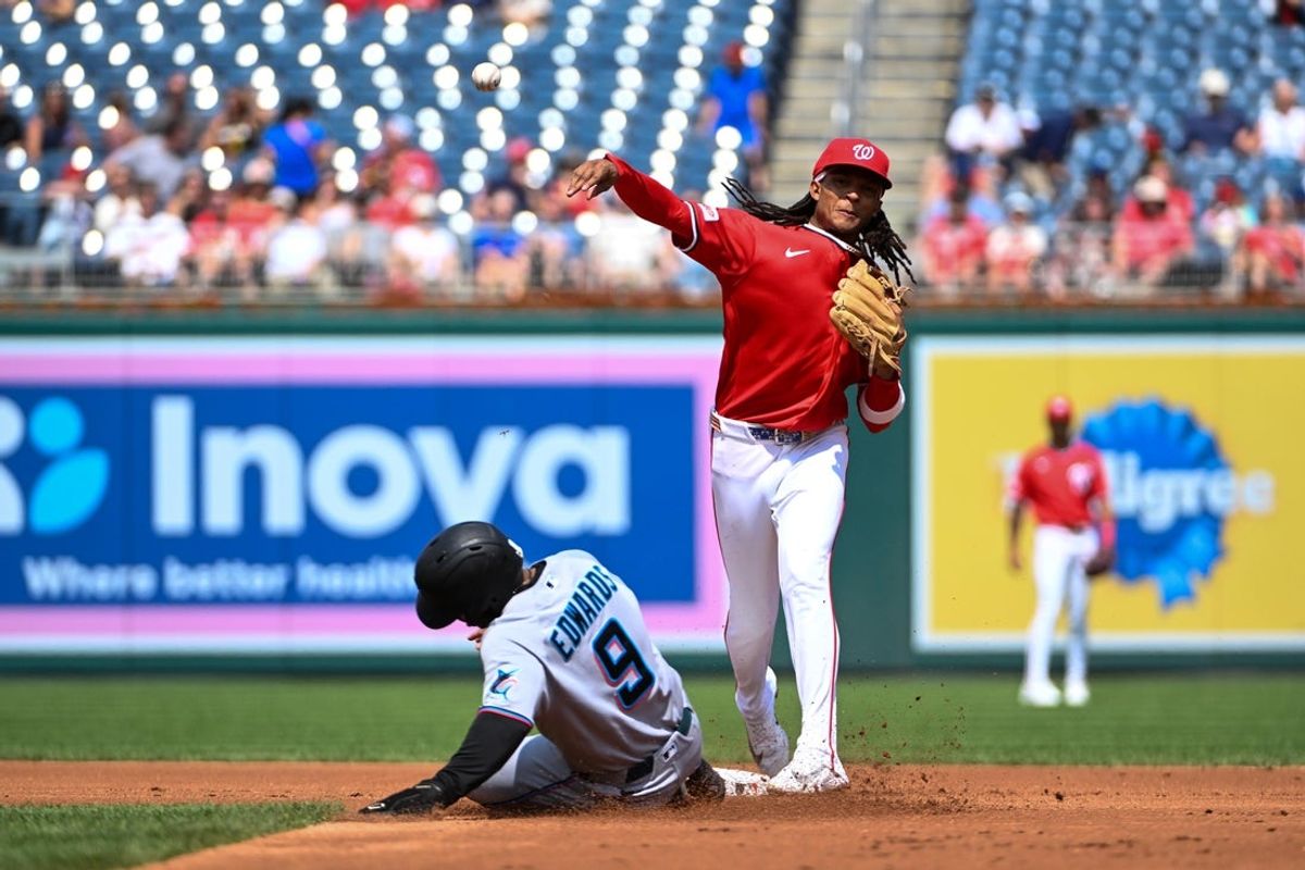 Aug 30, 2026; Washington, District of Columbia, USA; Washington Nationals second baseman CJ Abrams (5) forces Miami Marlins second baseman Xavier Edwards (9) and throws to complete a double play during the second inning at Nationals Park. Mandatory Credit: Brad Mills-Imagn Images