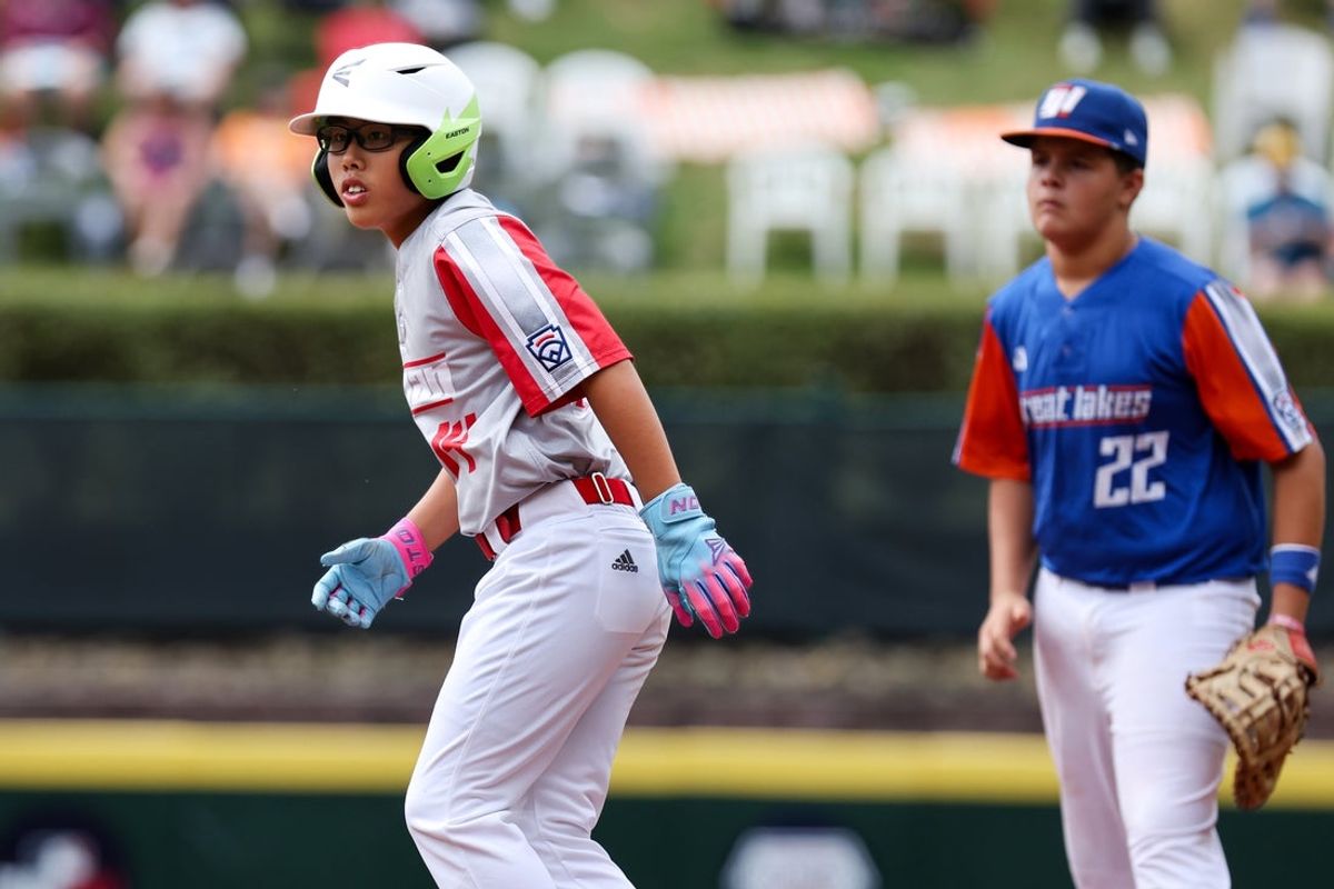 Aug 30, 2026; South Williamsport, PA, USA;  Japan Region left fielder Taiga Yumitori (14) takes a lead off of first base during the third inning against the Great Lakes Region in the third place consolation game at Howard J. Lamade Stadium.  Mandatory Credit: Matthew O'Haren-Imagn Images