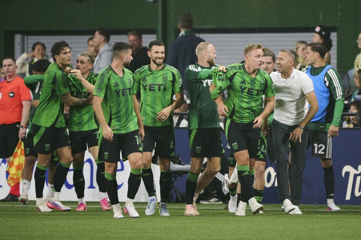 Aug 29, 2026; Portland, Oregon, USA; Austin FC defender Oleksandr Svatok (5) celebrates with teammates and interim head coach Davy Arnaud during the second half against the Portland Timbers at Providence Park. Mandatory Credit: Troy Wayrynen-Imagn Images