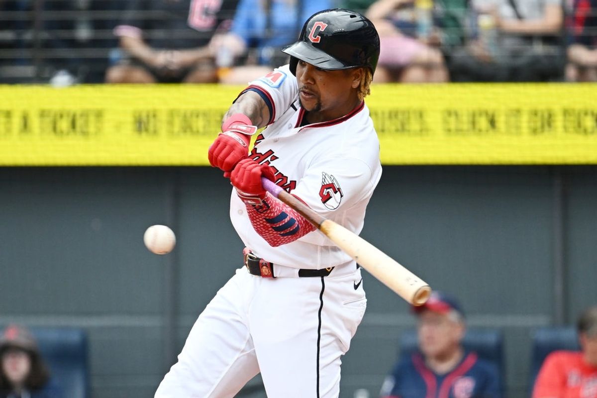 Aug 30, 2026; Cleveland, Ohio, USA; Cleveland Guardians designated hitter Jose Ramirez (11) hits a sacrifice fly during the first inning against the Kansas City Royals at Progressive Field. Mandatory Credit: Ken Blaze-Imagn Images